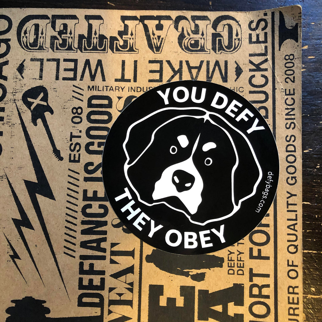 YOU DEFY, THEY OBEY | The Otis Sticker | White on Black